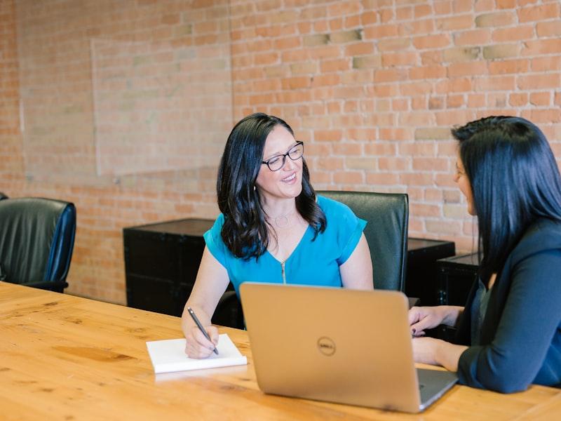 Two women working together